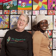 Sarah Wheeler, founder of the Dragon Cafe, with Angela, a patron phtographed at the Dragon Cafe, crypt of St George the Martyr Church, London